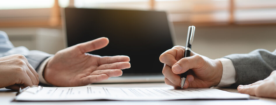 Hand of landlord, realtor pointing sign signature contract rental, purchase, buyer home or apartment with tenant, client after banker agreement mortgage, loan success or done. Property agent concept