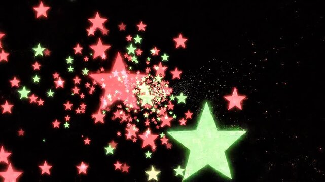 Red and green Christmas sparkles drifting gently moving through
