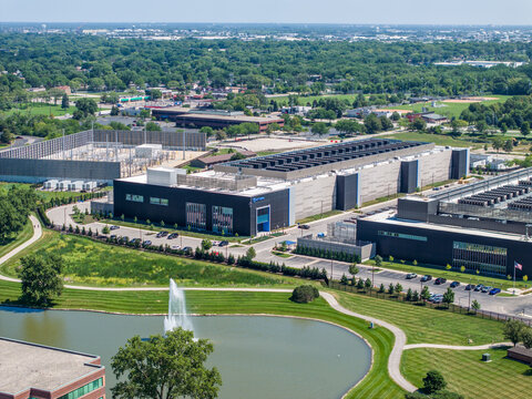 Aerial view of NTT Global Data Center campus with water fountain pond