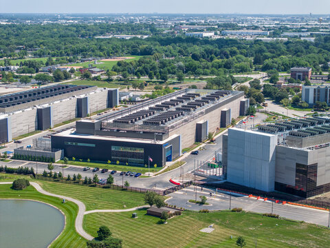 Aerial view of NTT Global Data Center building facade and security gate entrance