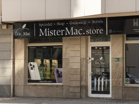 Poznan, Poland - February 28, 2026: MisterMac store storefront with electronic gadget displays and signage, illustrating professional retail consumer technology sales and service hub