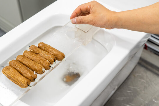 Test the toilet's flushing ability by dropping an object into it.
