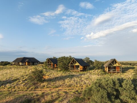 The Ta Shebube Rooiputs Lodge in the Kalahari Desert during the rainy season with green vegetation. Aerial view. Drone shot. Kgalagadi Transfrontier Park, Botswana