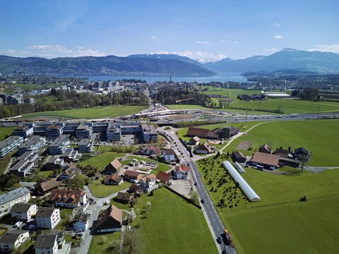 View of Lindencham with the motorway entrance, Lake Zug and Mount Rigi in the back, Cham, Canton of Zug, Switzerland