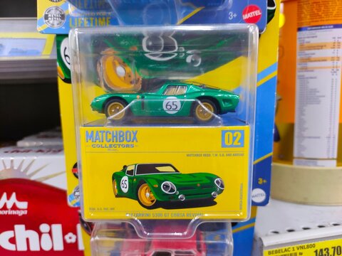 Malang, Indonesia - July 18, 2026: A green Matchbox Collectors Bizzarrini 5300 GT Corsa Revival die-cast car in its yellow and clear plastic display box.
