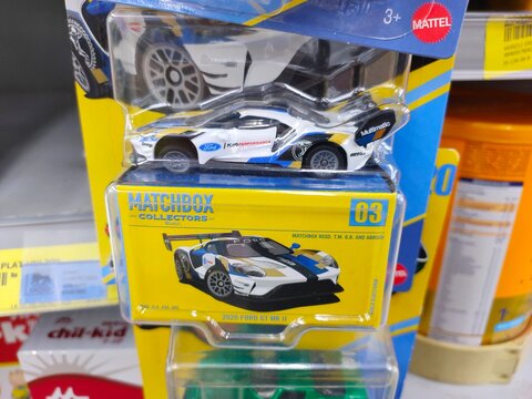 Malang, Indonesia - July 18, 2026: A white and blue Matchbox Collectors 2020 Ford GT Mk II die-cast car in its yellow and clear plastic display box.