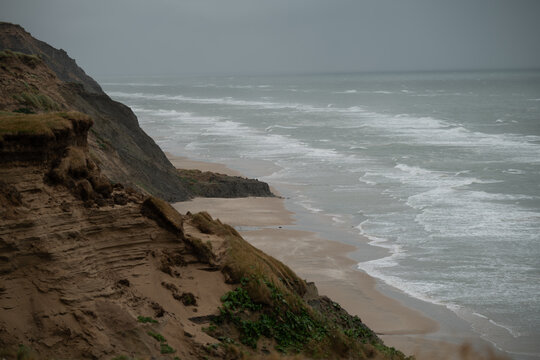Coastal Cliff View with Waves and Overcast Light