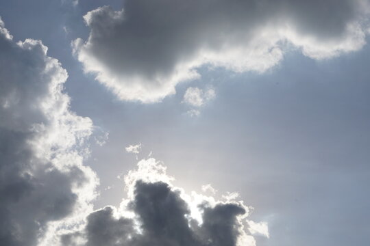 Sunlight breaking through dramatic storm clouds