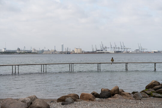 Port view over calm water with breakwater posts