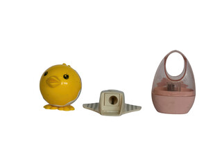 Yellow toy chick and pink egg shaped container isolated on white isolated on transparent background © Akhi-Store