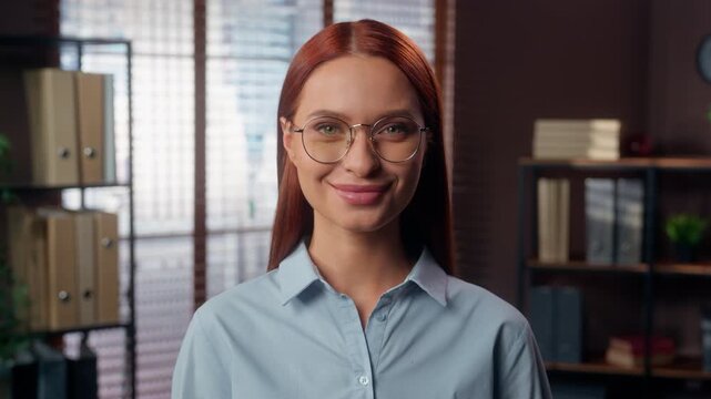 Portrait European businesswoman looking at camera smiling Caucasian business woman smile wearing glasses posing in agency executive girl formal entrepreneur happy optimistic female in corporate office