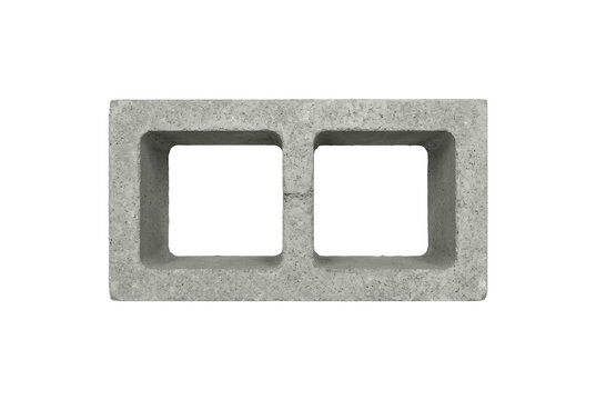 Grey concrete cinder block isolated on black background