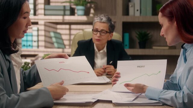 Business team briefing in office three multiethnic businesswomen arguing with documents low stats bad work result diversity women argue at conference managing data market review conflict brainstorm