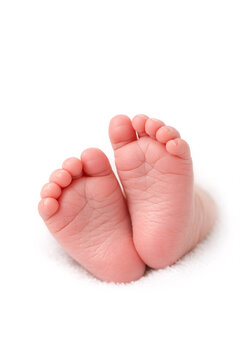 Delicate newborn baby feet, a symbol of innocence and the beginning of life.
