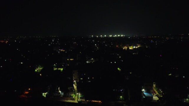 An aerial drone perspective showing a dark cityscape at Evening time, Howrah west bengal