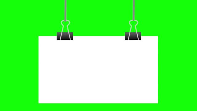 A white blank paper poster held by two binder clips drops down and sways gently against a chroma key green background.