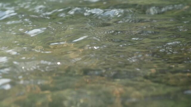 Details and texture of river water movement at moderate speed