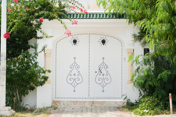 Fototapeta premium White Mediterranean building and Bougainvillea in Mediterranean Town