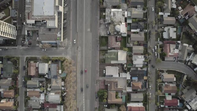 Top Down Aerial Shot Following A Street Leading To A Roundabout In Santiago Chile