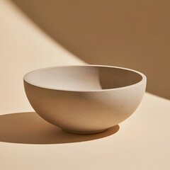 Fototapeta premium Minimalist Ceramic Bowl on Warm Beige Background