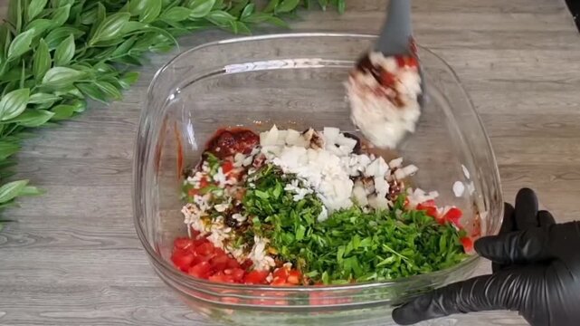 Mixing Mahshi Stuffing with Tomato Paste and Pomegranate Molasses