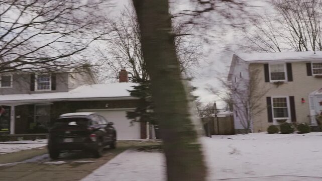 Winter View of American Suburban Homes from a Moving Car