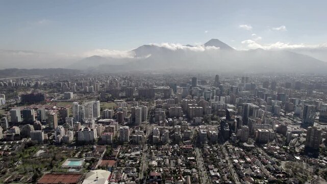 Aerial Drone Forward Flight Toward Cloud-Covered Hills In Santiago De Chile
