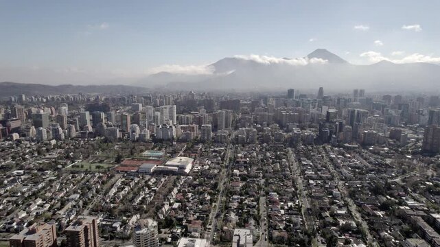 Cinematic Drone Ascending View Of Santiago Cityscape And Mountain Horizon