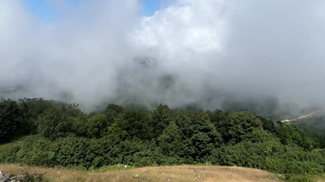 Low Clouds Rolling Over Mountain Forest in Kartepe Turkey captured in a dynamic summer nature scene, showing visible cloud movement across the Kartepe mountain landscape in Turkey.