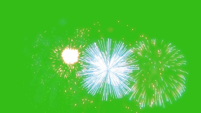 Bright fireworks burst isolated on a green screen background, featuring glowing particles and radiant light trails. Happy New Year, Independence Day, Mery Christmas, Memorial Day.