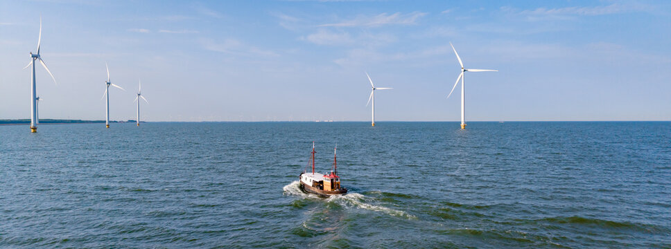 Exploring the serenity of Windmill Park in Flevoland, Netherlands on a tranquil day