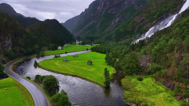 wild nature in Norway, aerial view of river and Vidfoss waterfall in a valley in Norway, Norwegian wilderness, travel in Norway, drone shot of Scandinavian nature