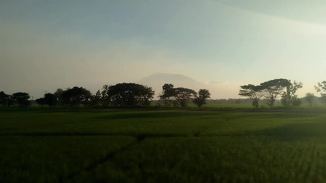 Sunset view outside the window from a moving train. traveling by train transportation