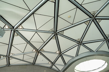 Modern geodesic dome ceiling structure with geometric patterns and integrated lighting © khomkrit