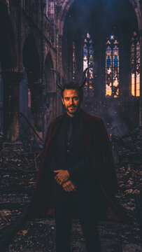 Halloween devil stands in ruined cathedral with glowing stained glass