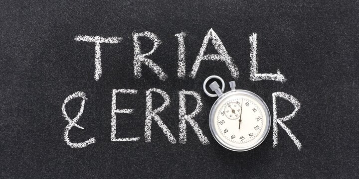 Trial and error chalk text, stopwatch on blackboard background