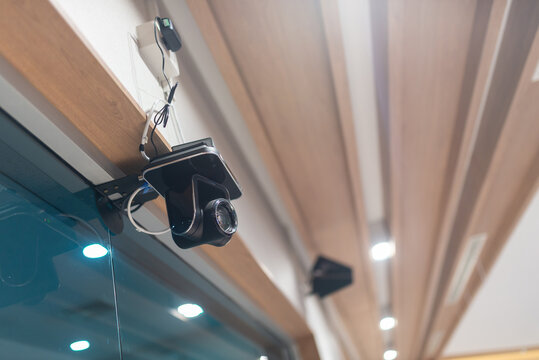Modern Surveillance Camera Installed on Ceiling
