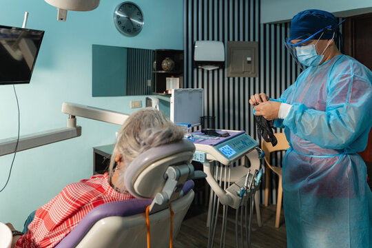 Health professional preparing for dental checkup appointment