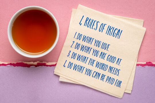 4 inspirational rules of Ikigai, Japanese lifestyle concept, on a napking with tea