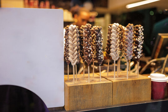 Traditional Chocolate Covered Waffle Skewers in Bruges Belgium Market