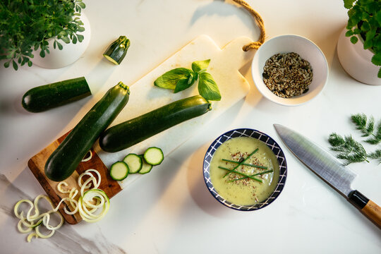 Preparing zucchini spaghetti and fresh healthy soup