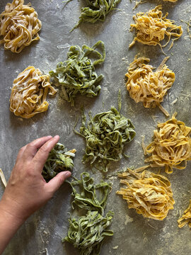 Making Fresh Pasta by Hand on a Kitchen Counter in Italy