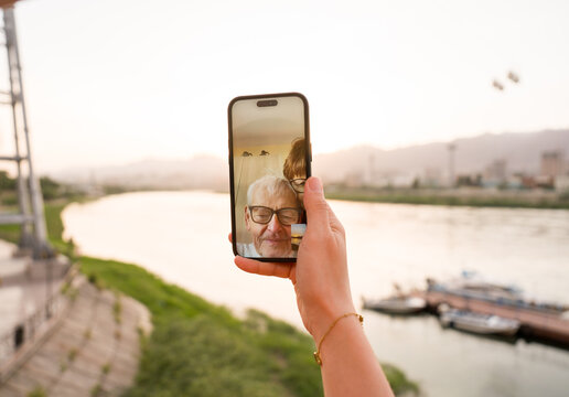 Video Call With Family At Syr Darya River in Khujand