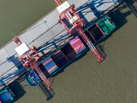 cargo port with cranes loading container ships