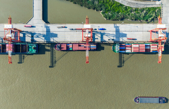 cargo port with cranes loading container ships