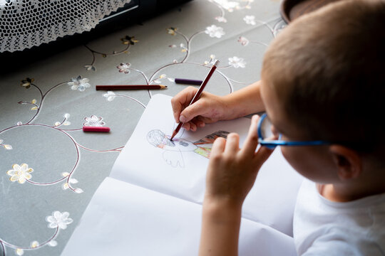 Child Coloring Drawing in Sketchbook