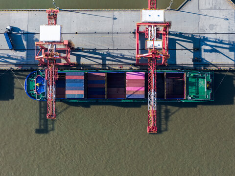 cargo port with cranes loading container ships