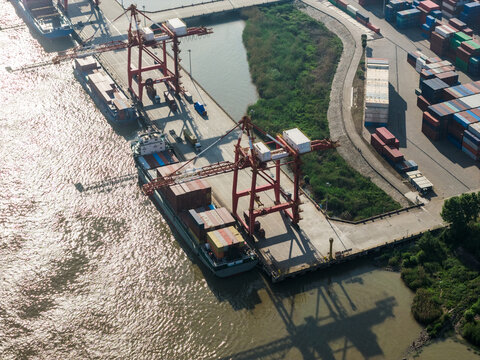 cargo port with cranes loading container ships