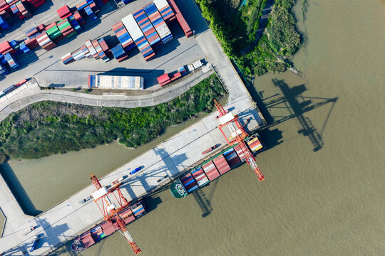 cargo port with cranes loading container ships