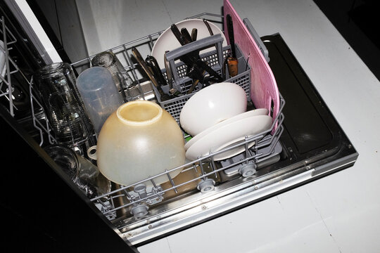 Close-up of modern technology tech dishwasher machine with flashlight
